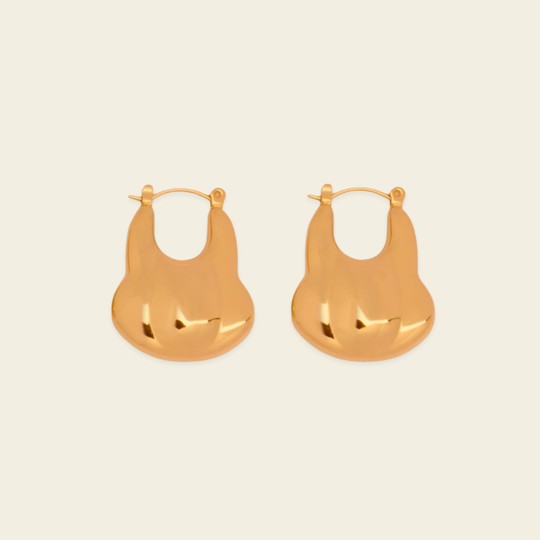 Liquid Loop Earrings with broad polished irregular hoop shapes in gold finish