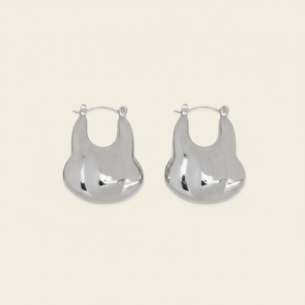 Liquid Loop Earrings with broad polished irregular hoop shapes in silver finish