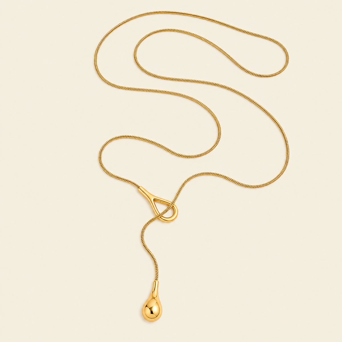 Liquid Loop Necklace with a fine lariat chain with an open loop and teardrop end in gold finish