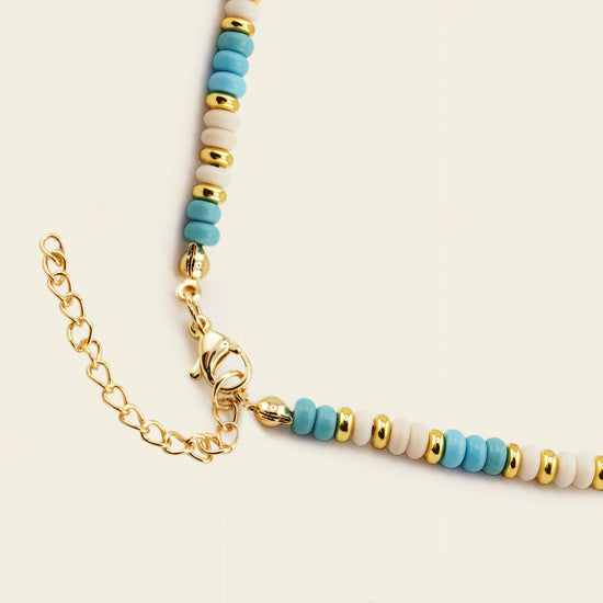Marina Rhythm Necklace with turquoise-coloured disc beads and gold-coloured accents