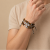Midnight Line Bracelet worn on the wrist, with round stone beads and small metal accents