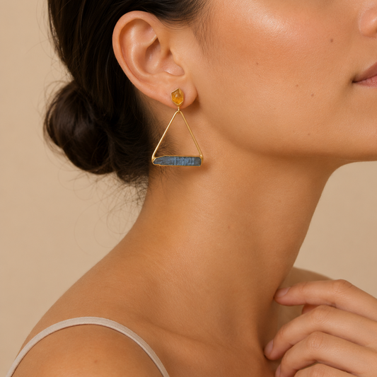 Midnight Line Earrings worn on the ear, with open triangular frames and dark horizontal stone bars