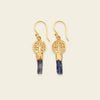 Midnight Roots Earrings with round gold-coloured motifs above slim blue stone drops