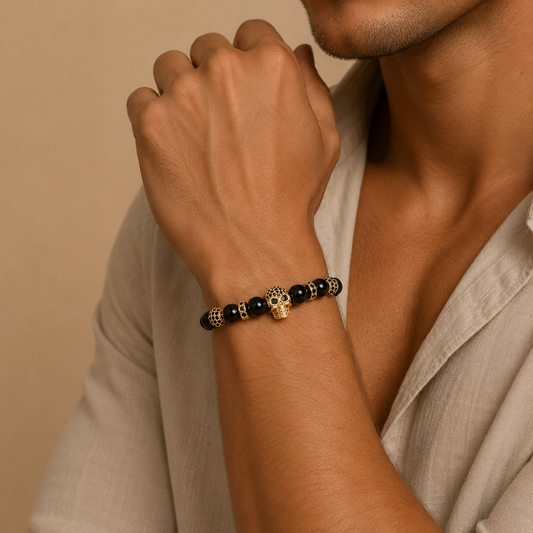 Midnight Skull Bracelet worn on the wrist, with dark round beads and skull-shaped metal accents