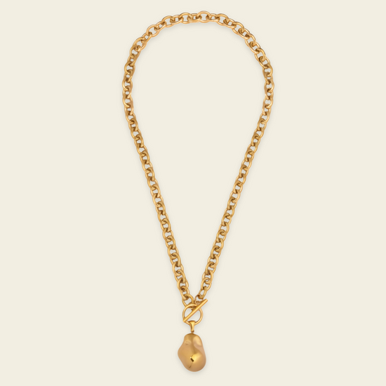 Molten Drop Necklace with a chunky chain and rounded teardrop pendant in gold finish