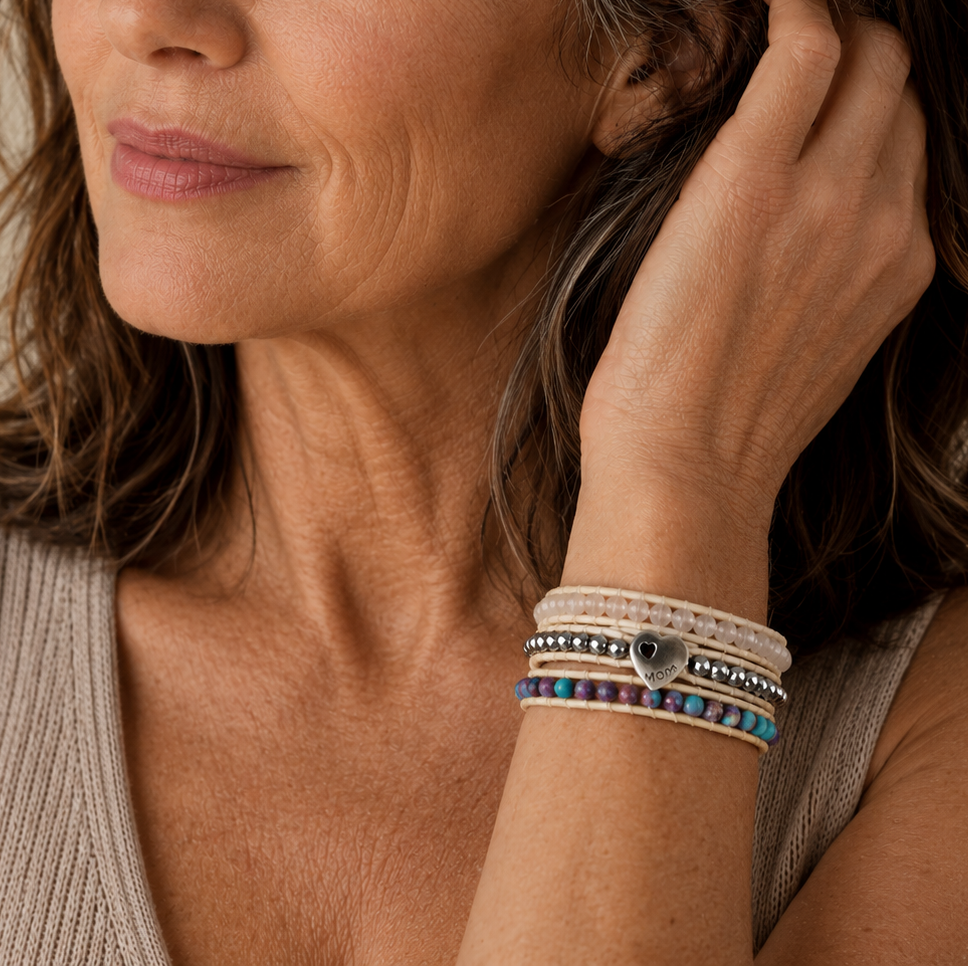 Mom Heart Bracelet worn on the wrist, with layered pale beads and a heart motif