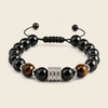 Night Axis Bracelet with dark round beads and a rectangular metal accent