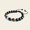 Night Axis Bracelet with dark round beads and a rectangular metal accent