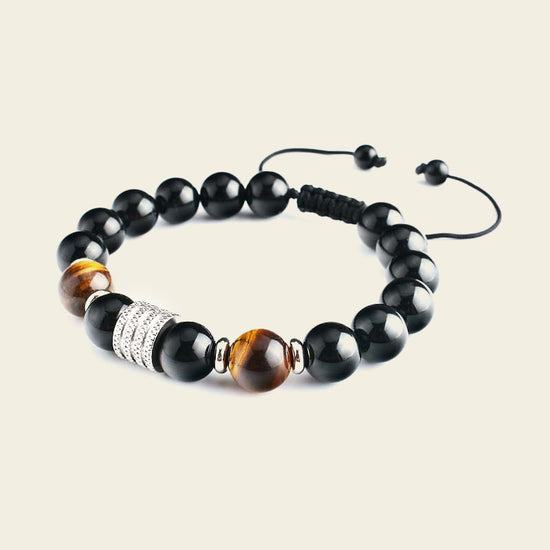 Night Axis Bracelet with dark round beads and a rectangular metal accent