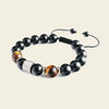 Night Axis Bracelet with dark round beads and a rectangular metal accent
