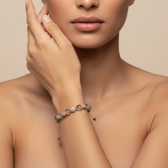 Obsidian Drift Bracelet worn on the wrist, with faceted round beads with small metal accents