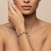 Obsidian Drift Bracelet worn on the wrist, with faceted round beads with small metal accents