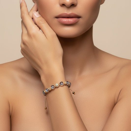 Obsidian Drift Bracelet worn on the wrist, with faceted round beads with small metal accents