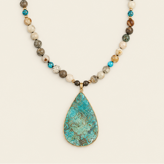Ocean Drift Necklace with earth-toned beads and a turquoise-coloured teardrop pendant