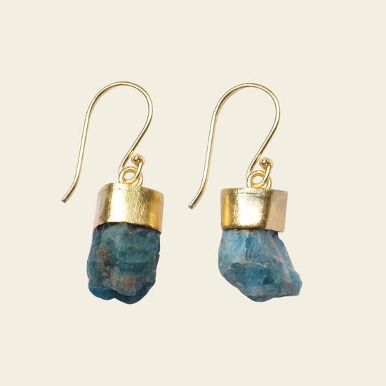 Ocean Spark Earrings with rough blue stone drops with gold-coloured caps