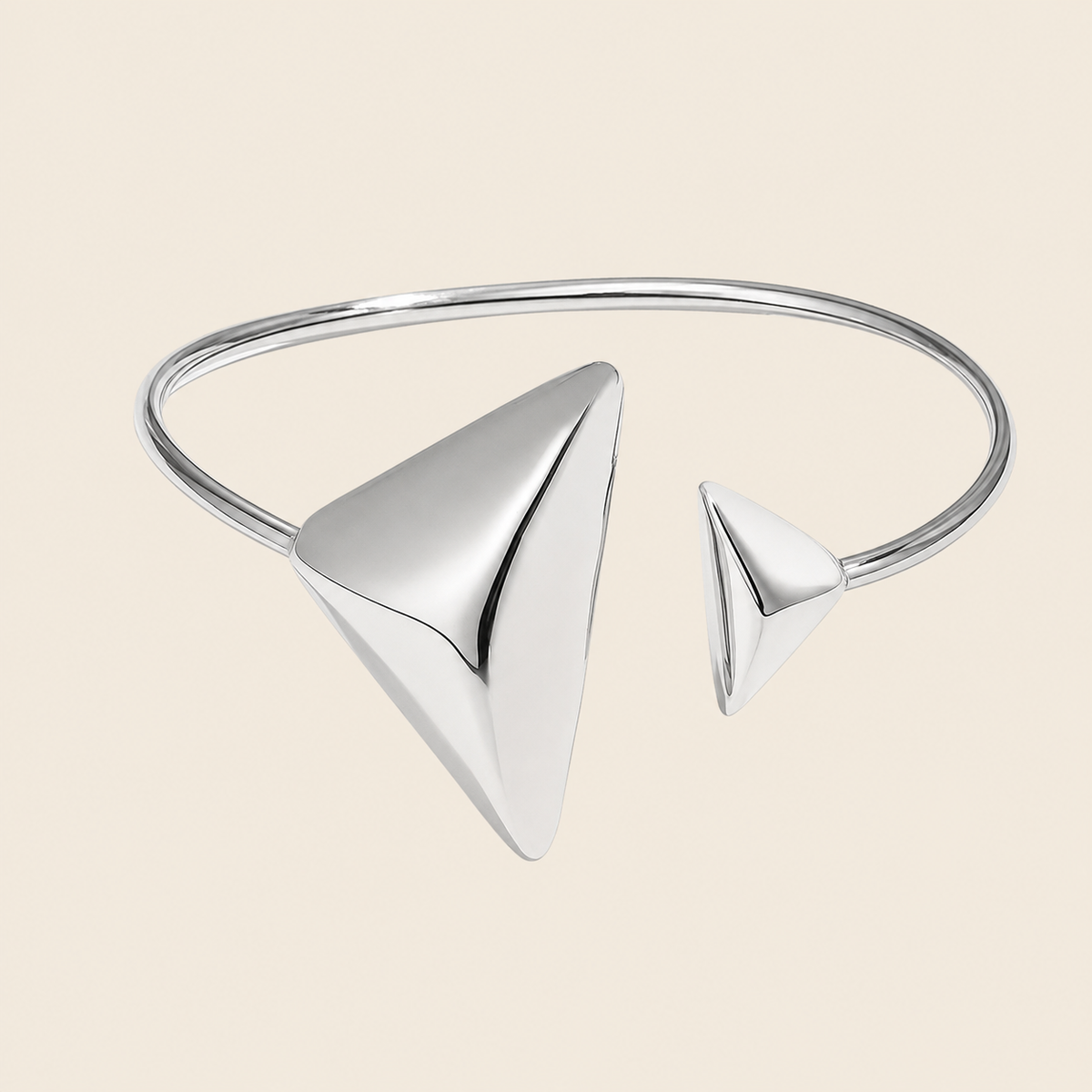 Offset Apex Cuff with an open band with asymmetric triangular ends in silver finish
