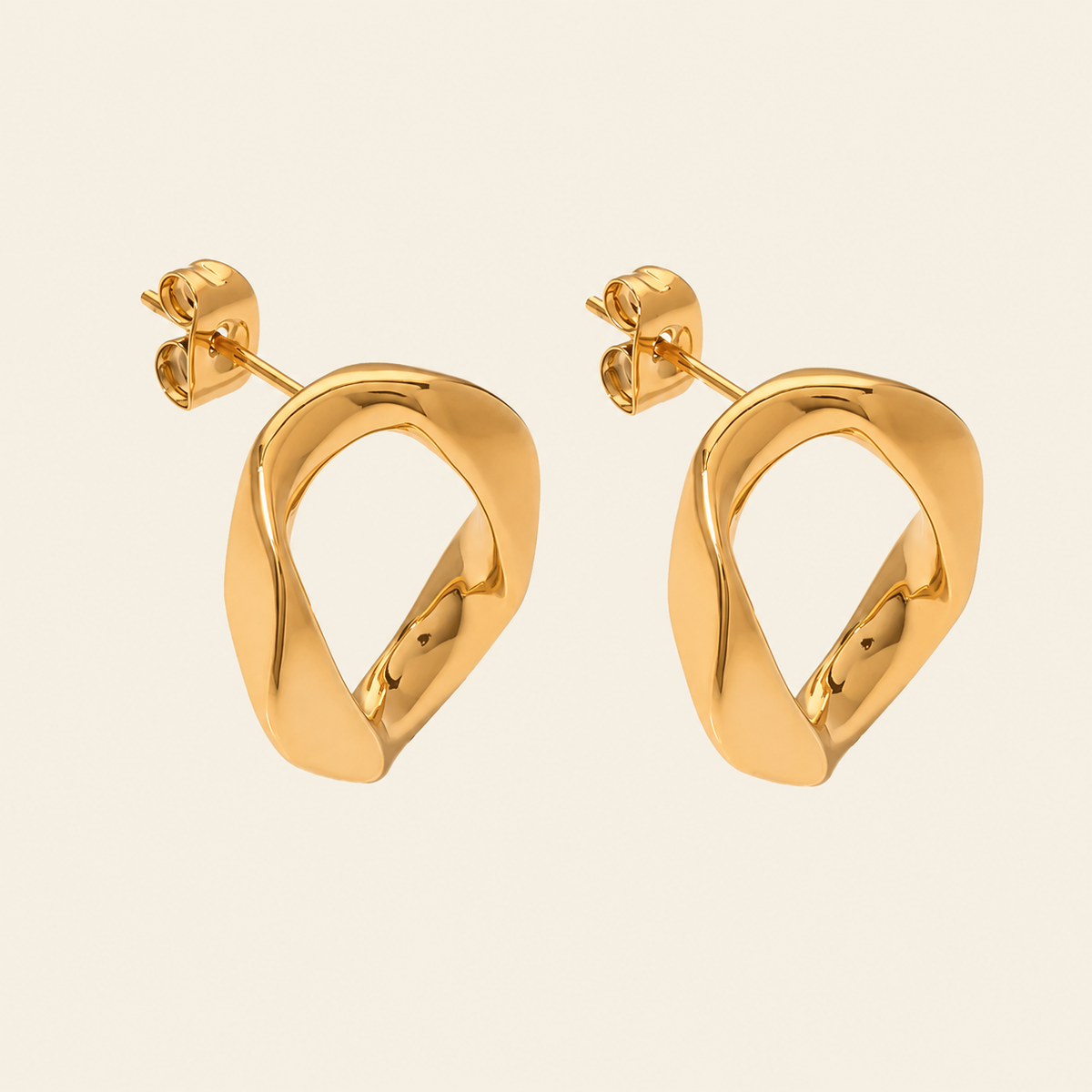 Open Form Earrings with open asymmetric geometric stud shapes in gold finish