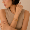 Orbit Link Bracelet worn on the wrist in gold finish