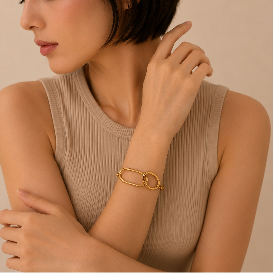 Orbit Link Bracelet worn on the wrist in gold finish