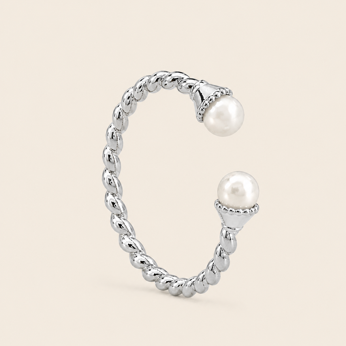 Pearl Arc Ring with an open twisted band with pearl ends in silver finish