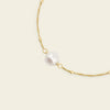 Pearl Line Bracelet with a fine chain with a central pearl detail in gold finish