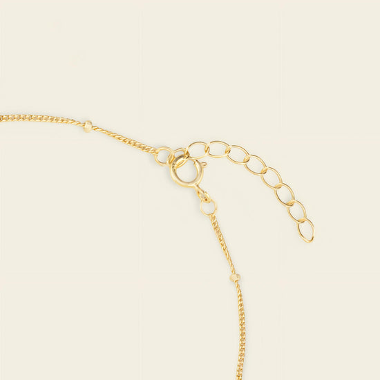 Pearl Line Bracelet, showing the fastening detail in gold finish