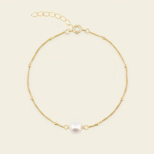 Pearl Line Bracelet with a fine chain with a central pearl detail in gold finish
