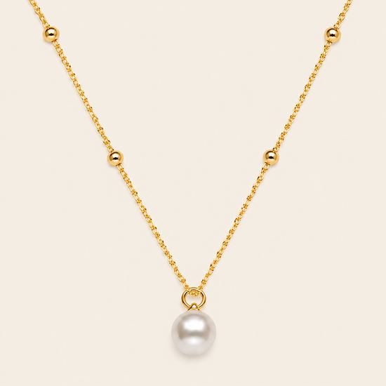 Pearl Trace Necklace with a fine chain and a single pearl drop in gold finish