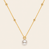 Pearl Trace Necklace with a fine chain and a single pearl drop in gold finish