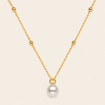 Pearl Trace Necklace with a fine chain and a single pearl drop in gold finish
