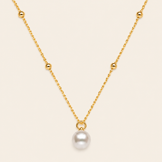 Pearl Trace Necklace with a fine chain and a single pearl drop in gold finish