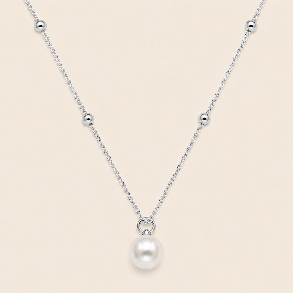 Pearl Trace Necklace with a fine chain and a single pearl drop in silver finish