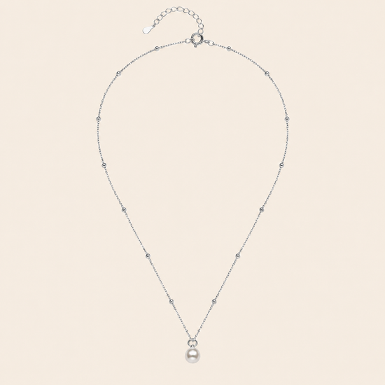 Pearl Trace Necklace with a fine chain and a single pearl drop in silver finish