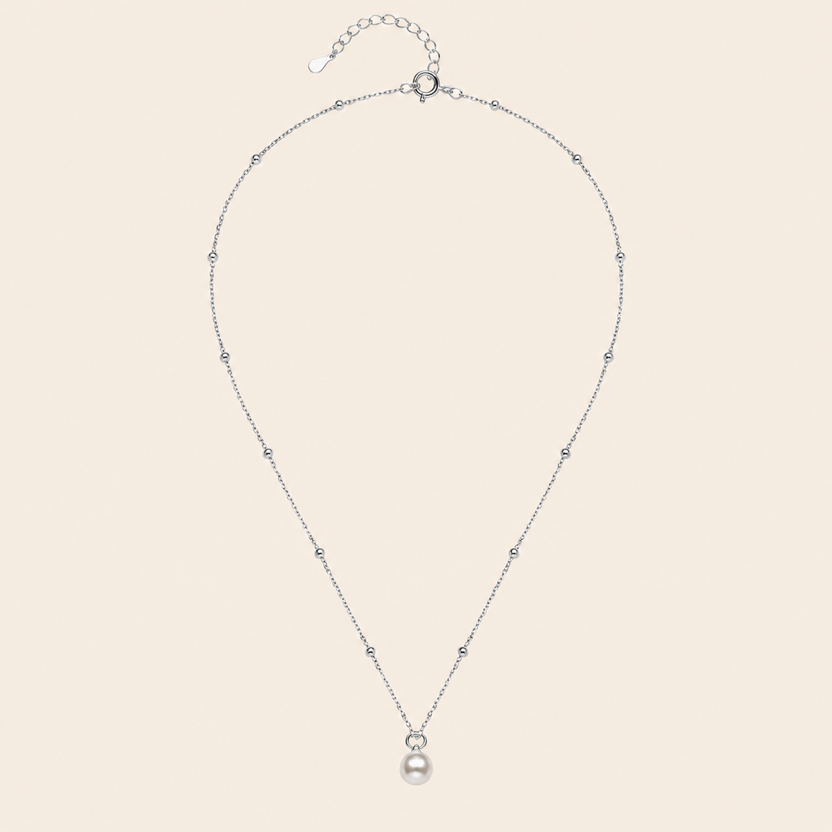 Pearl Trace Necklace with a fine chain and a single pearl drop in silver finish