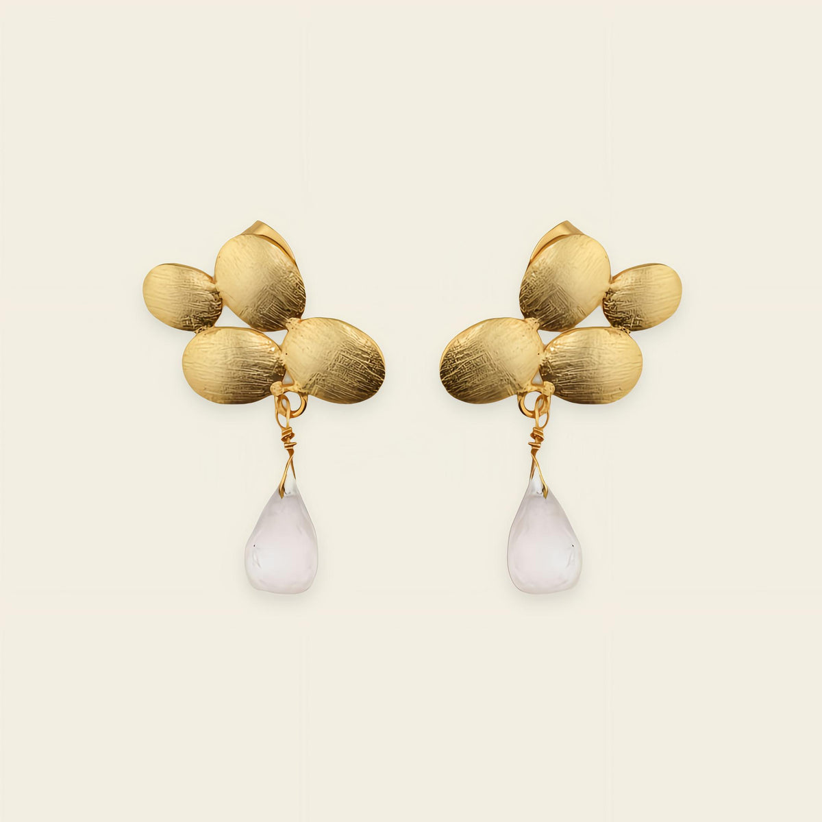 Petal Glow Earrings with gold-coloured flower tops and pale teardrop drops