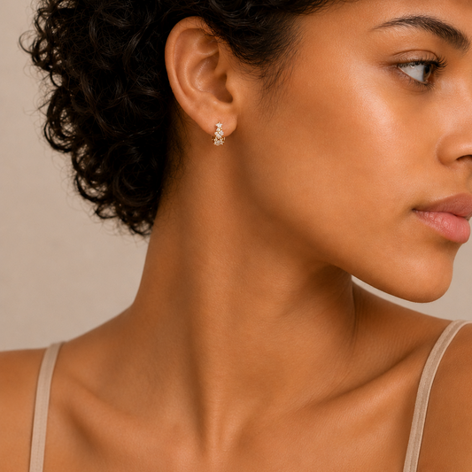 Petal Light Earrings worn on the ear in gold finish