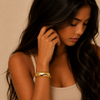 Polished Dome Cuff worn on the wrist in gold finish