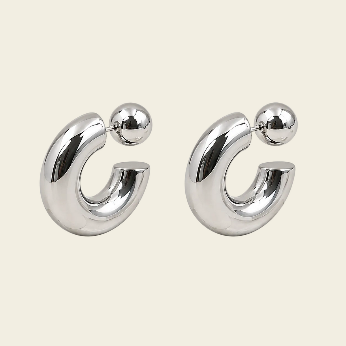 Polished Orbit Earrings with polished open circular shapes in silver finish