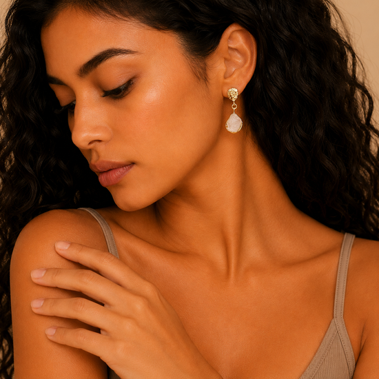 Quartz Trace Earrings worn on the ear in gold finish