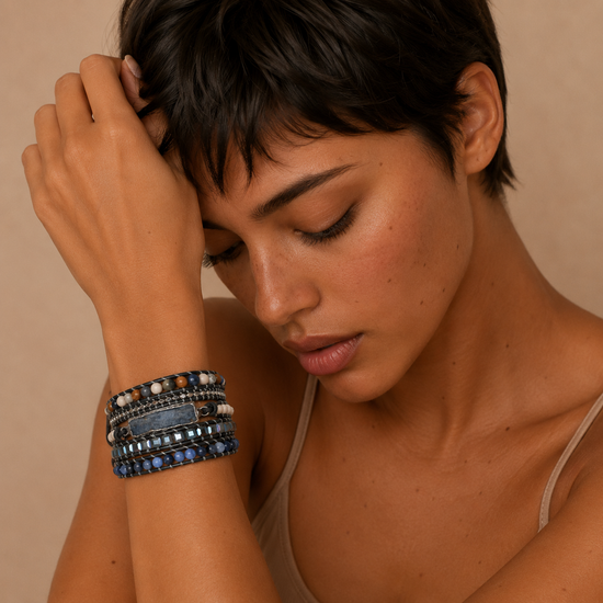 Quiet Depth Bracelet worn on the wrist, with layered dark blue and grey beads