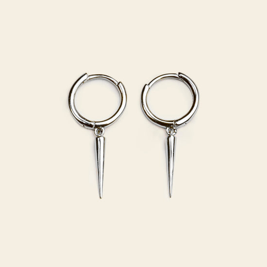 Quiet Edge Earrings with small hoops with pointed spike charms in silver finish