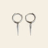 Quiet Edge Earrings with small hoops with pointed spike charms in silver finish