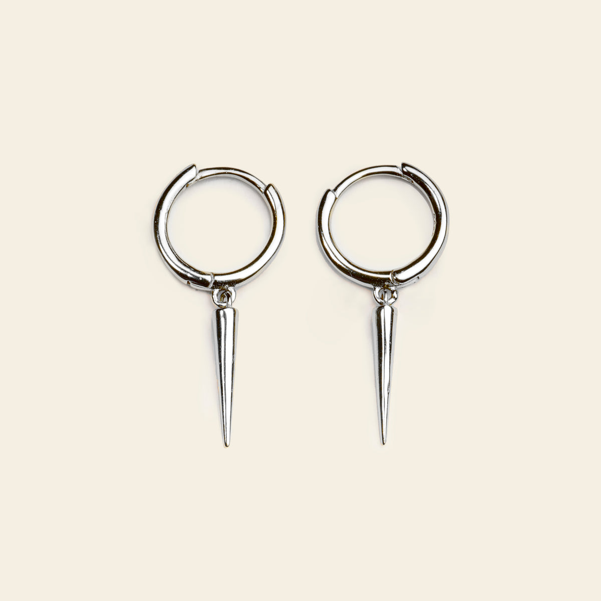 Quiet Edge Earrings with small hoops with pointed spike charms in silver finish