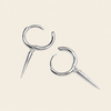 Quiet Edge Earrings with small hoops with pointed spike charms in silver finish