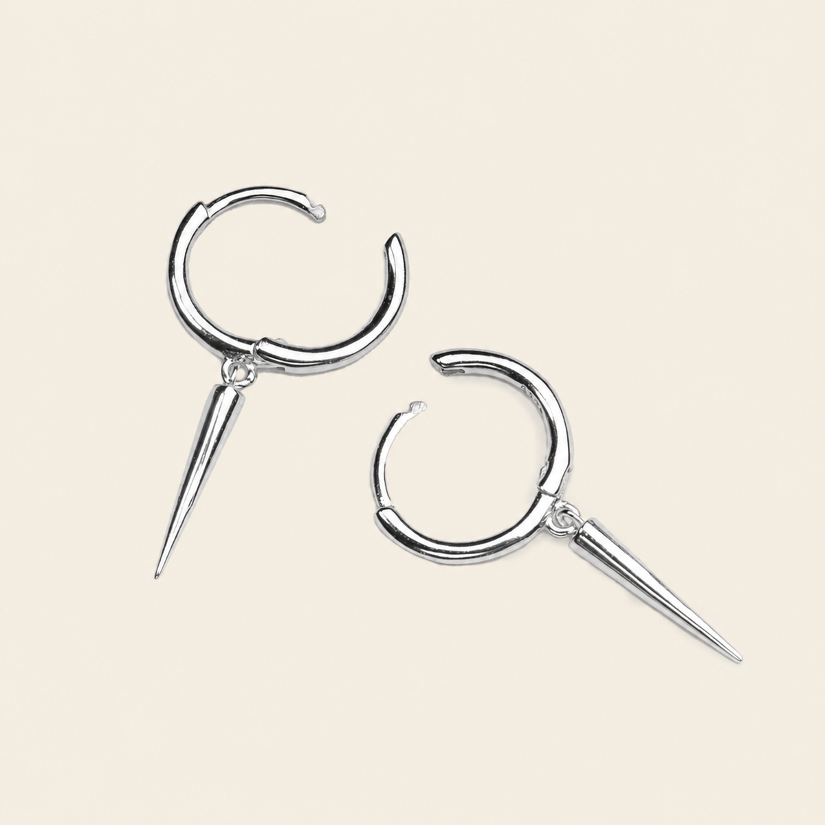 Quiet Edge Earrings with small hoops with pointed spike charms in silver finish