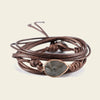 Quiet Ember Bracelet with a grey stone centre on layered brown cord