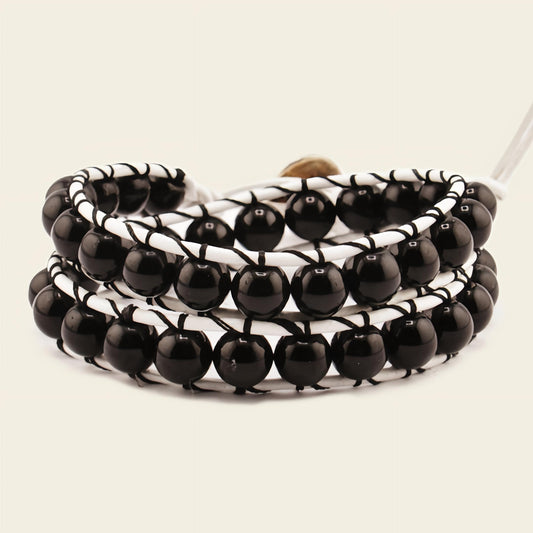 Quiet Form Bracelet with round beads woven onto contrasting cord