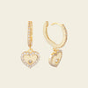 Quiet Heart Earrings with heart-shaped charms on small hoops in gold finish