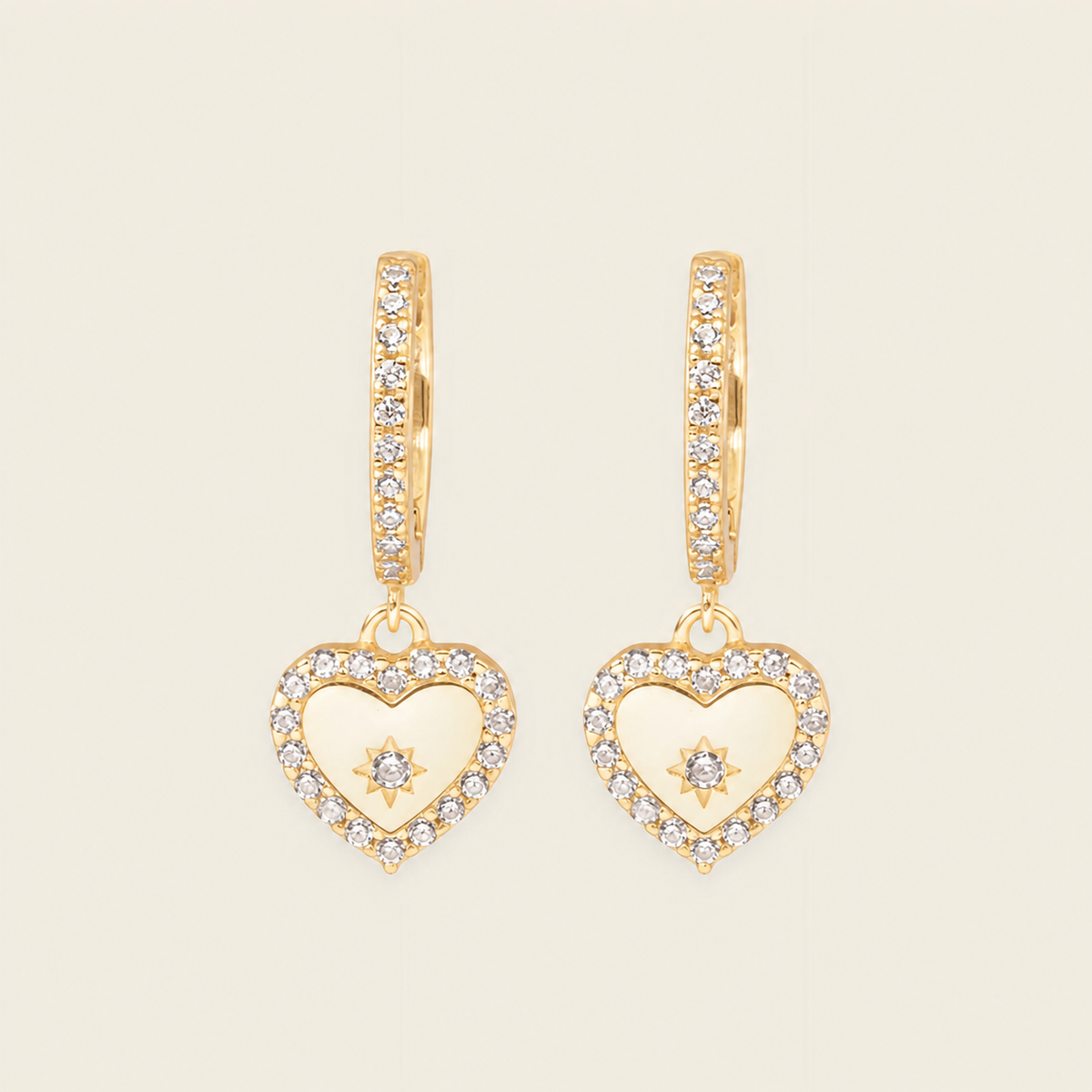 Quiet Heart Earrings with heart-shaped charms on small hoops in gold finish