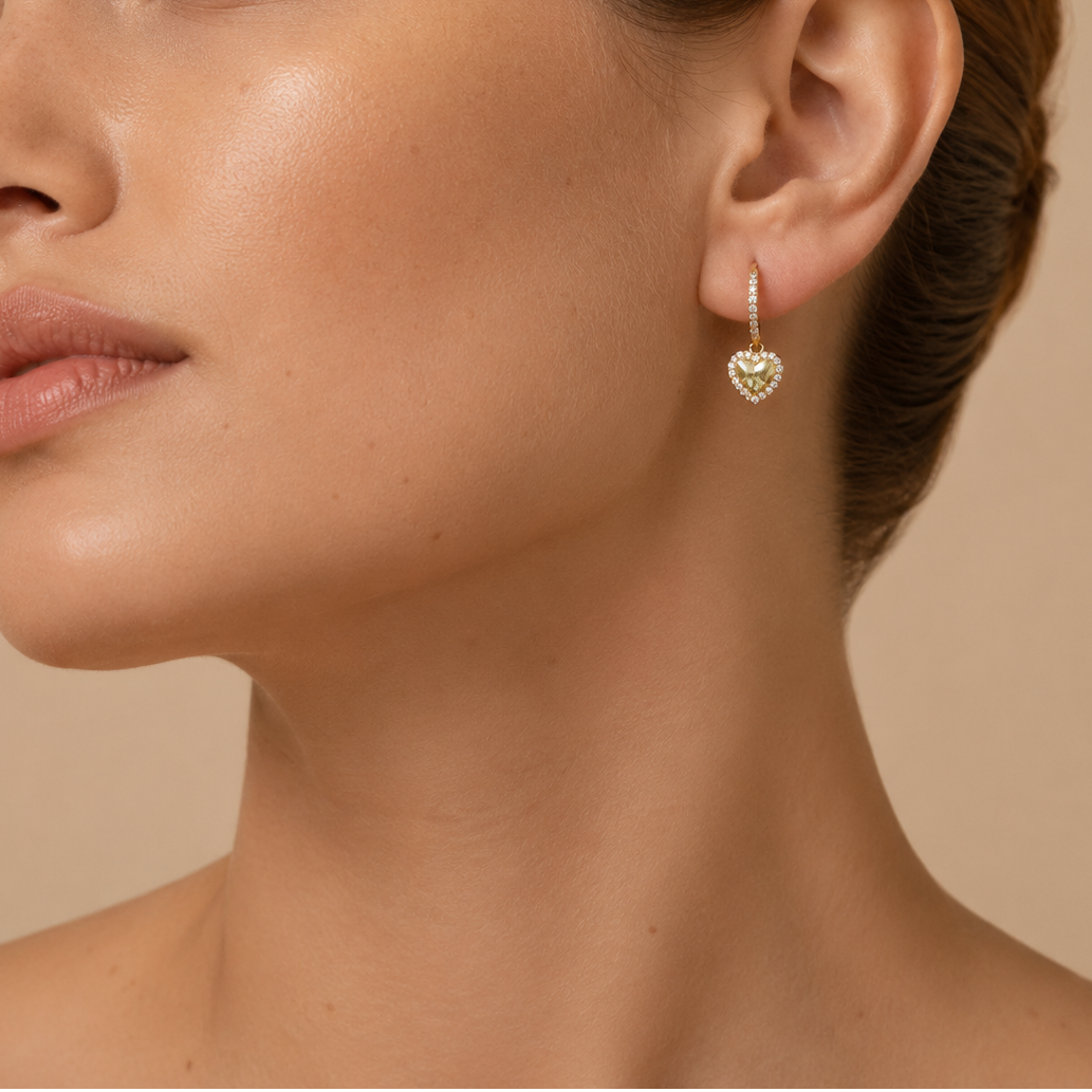Quiet Heart Earrings worn on the ear in gold finish